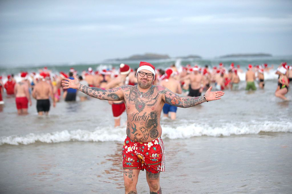 Jonathan Boyd at a charity Christmas swim at Portrush East Strand beach in Co Antrim. (Photo by Steven McAuley/PA Images via Getty Images)