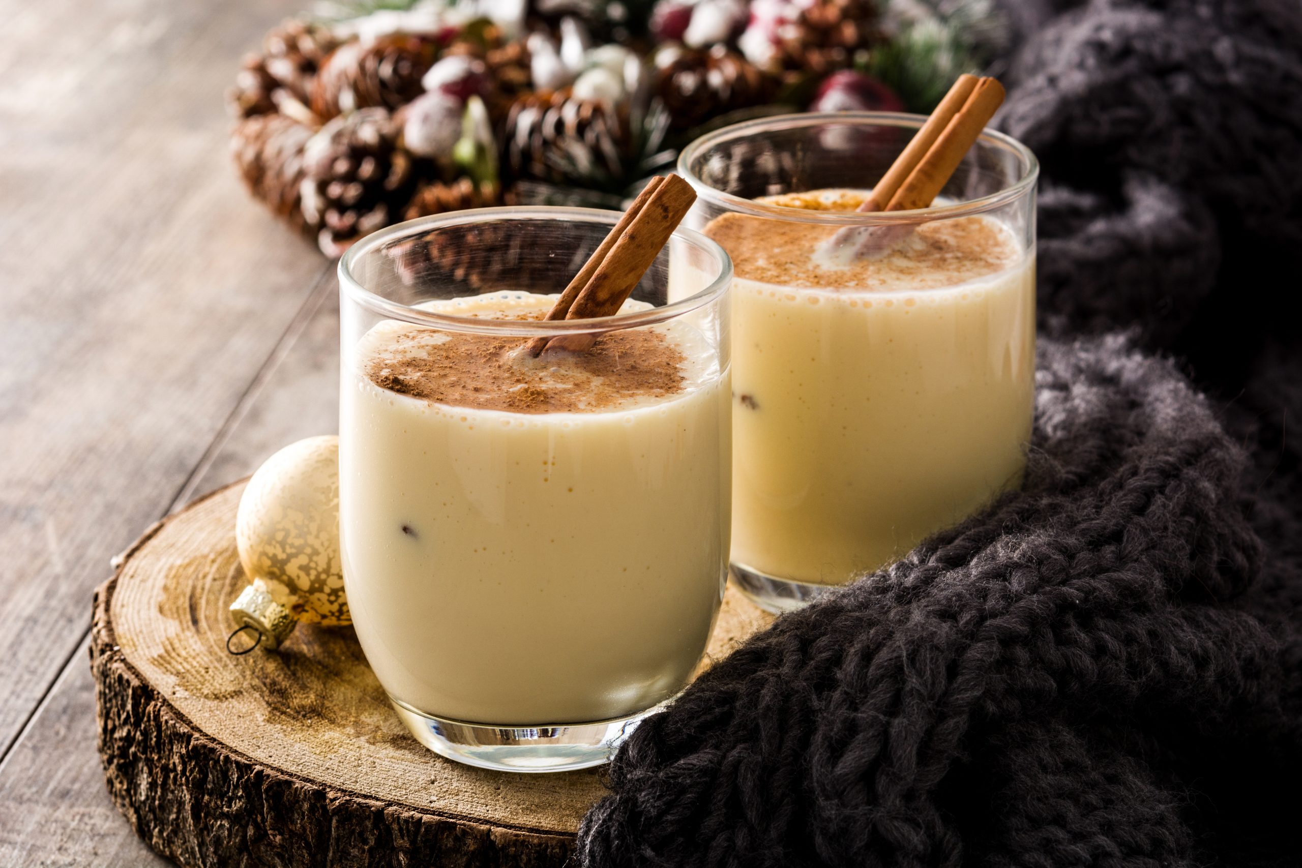 Homemade,Eggnog,With,Cinnamon,In,Glass,On,Wooden,Table.,Typical
